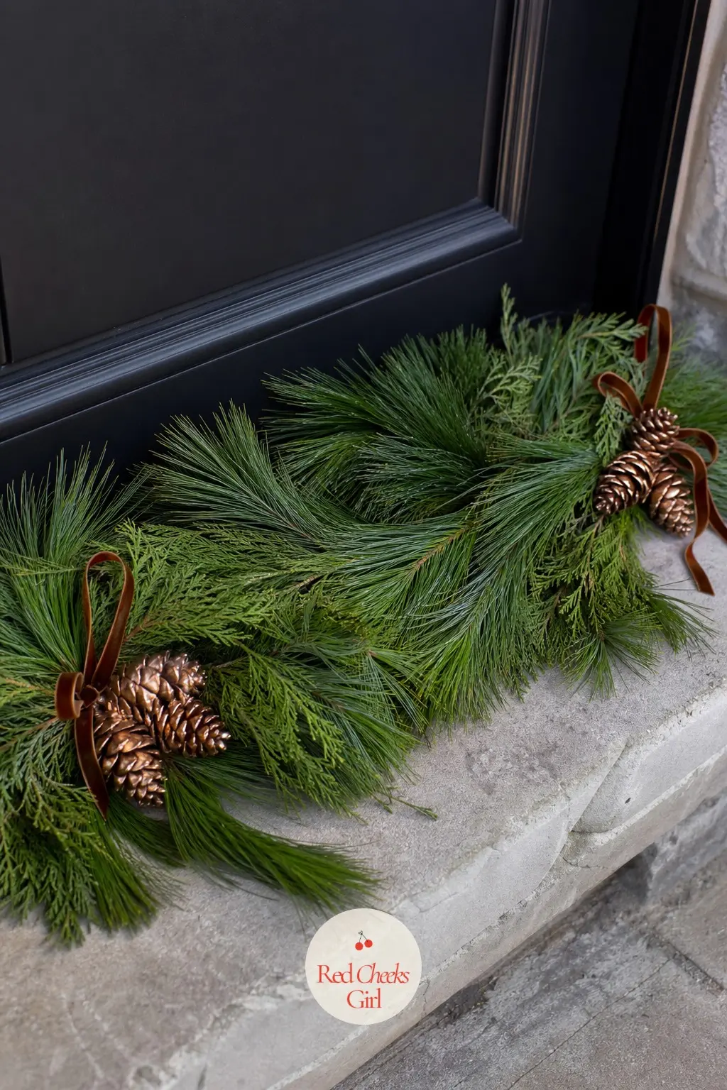 A Fresh Pine Swag Laid Flat Along the Threshold — Instead of hanging greenery, lay a fresh pine swag flat along the threshold itself, one copper pinecone pick