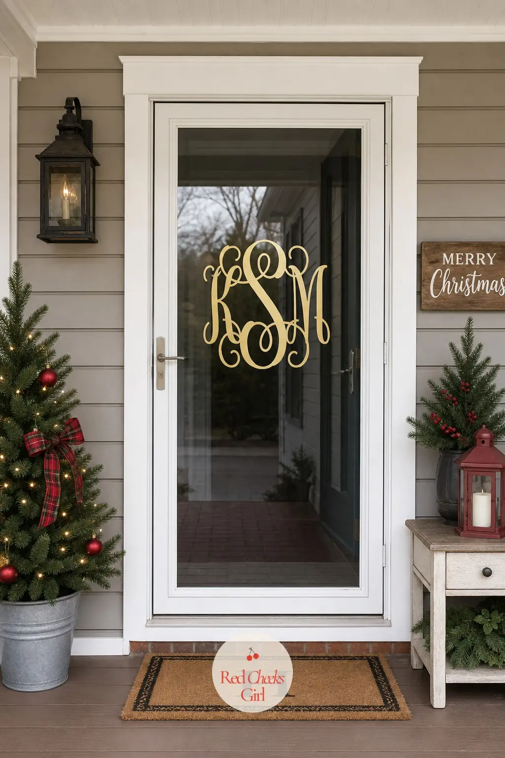 A Gold Monogram Cling Centered on Storm Door Glass — A single large initial in gold static cling script sits centered on the glass of a storm door, nothing