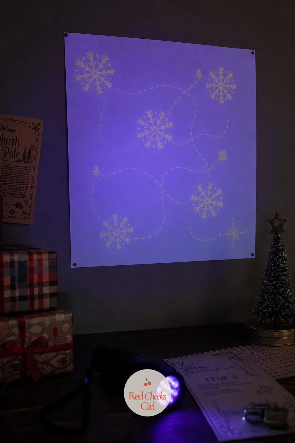 Blacklight Snowflake Map — A plain sheet of paper, dotted here and there with snowflakes drawn in UV pen, looks blank under the tree lights. Christmas escape