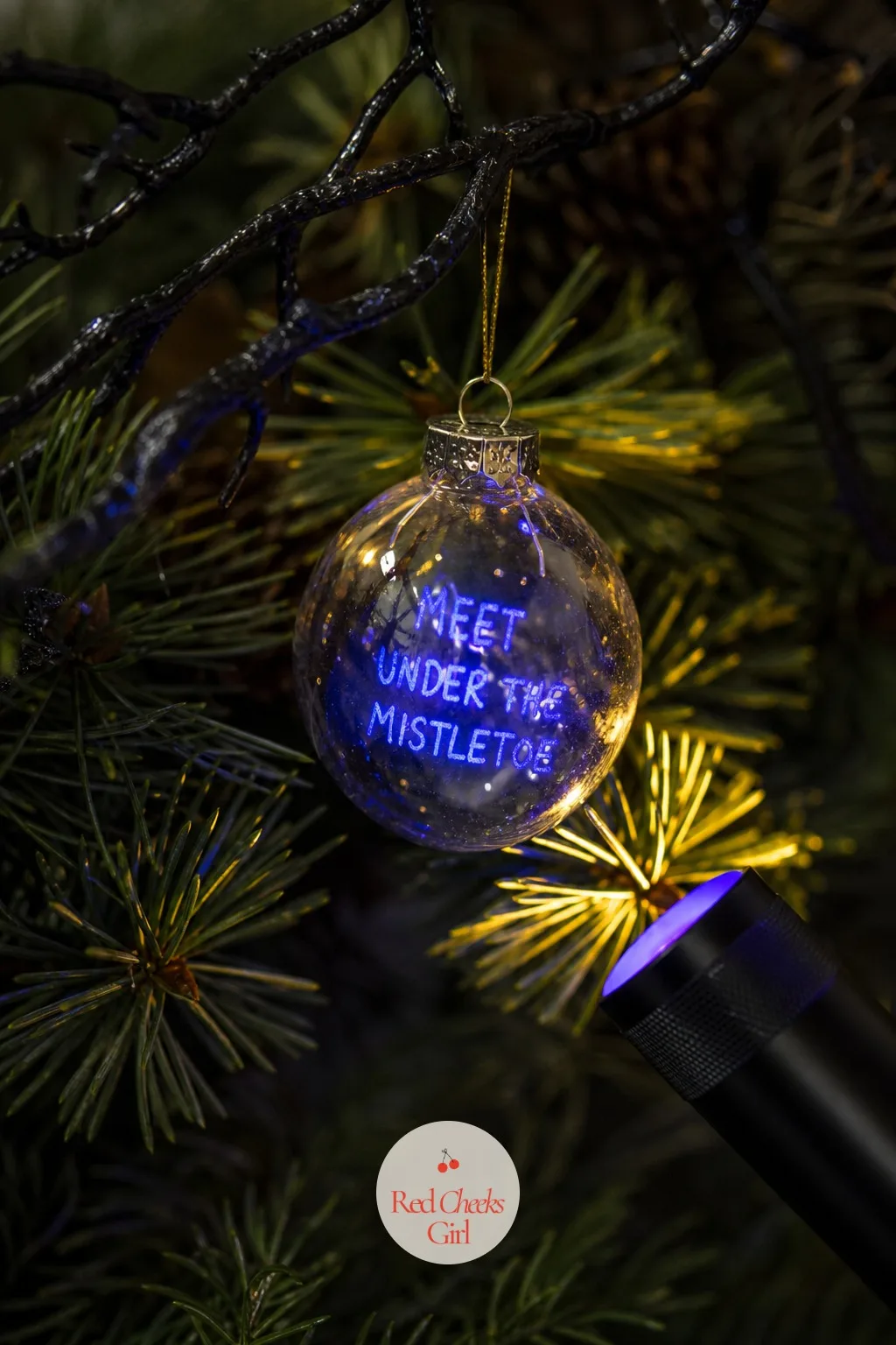 UV Flashlight Message on an Ornament — Write a message in a UV-reactive pen on a plain glass ornament and it stays invisible in ordinary light, a genuinely