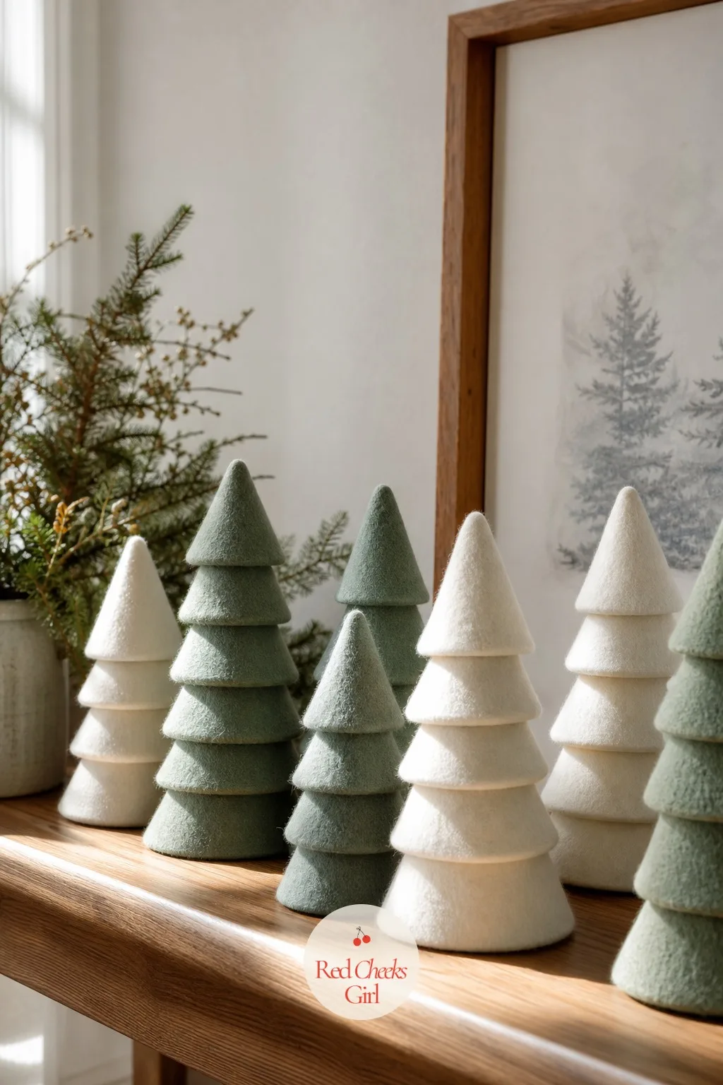 Stacked Felt Cone Trees — You do not need a real tree in every corner of the house, and these solve the mantel without the needles. Christmas felt crafts