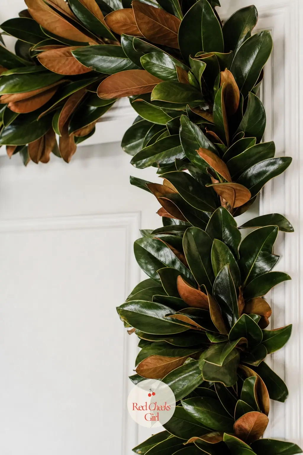 Glossy Magnolia Leaves — A garland of glossy magnolia leaves, dark green on the front and bronze velvet on the back, around a doorway is the single most