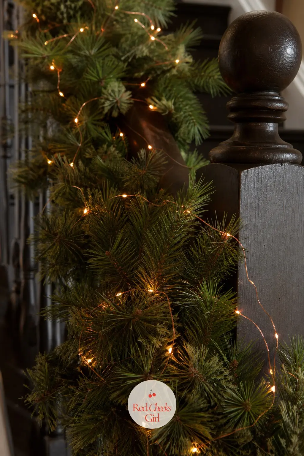 Copper Fairy Lights Woven Through Pine — Warm copper-toned bulbs, rather than the usual plain white, give a pine garland a slightly amber glow that looks