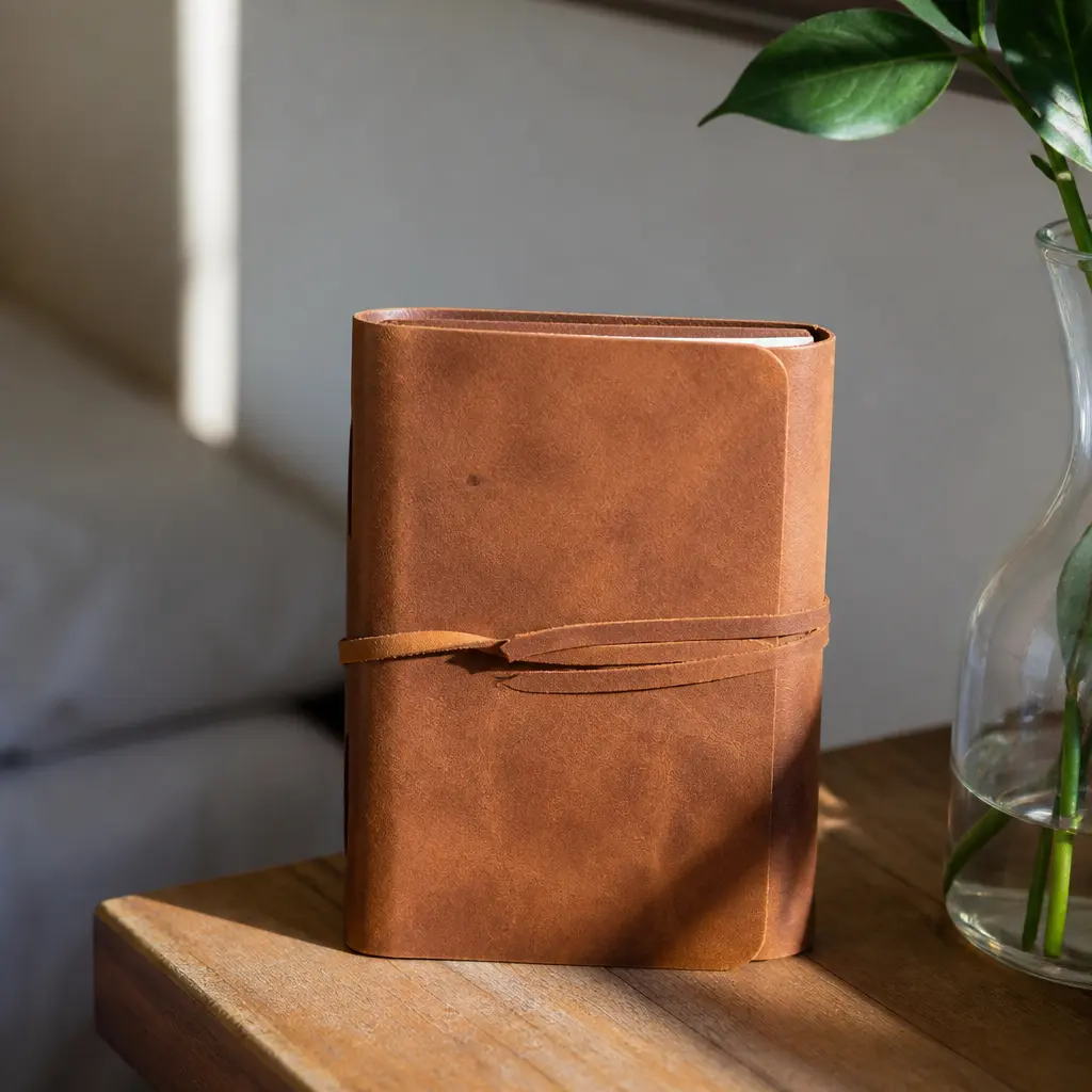 Leather Journal — She keeps lists on receipts and the backs of envelopes because she has never had a notebook worth keeping. Christmas gift ideas for mom