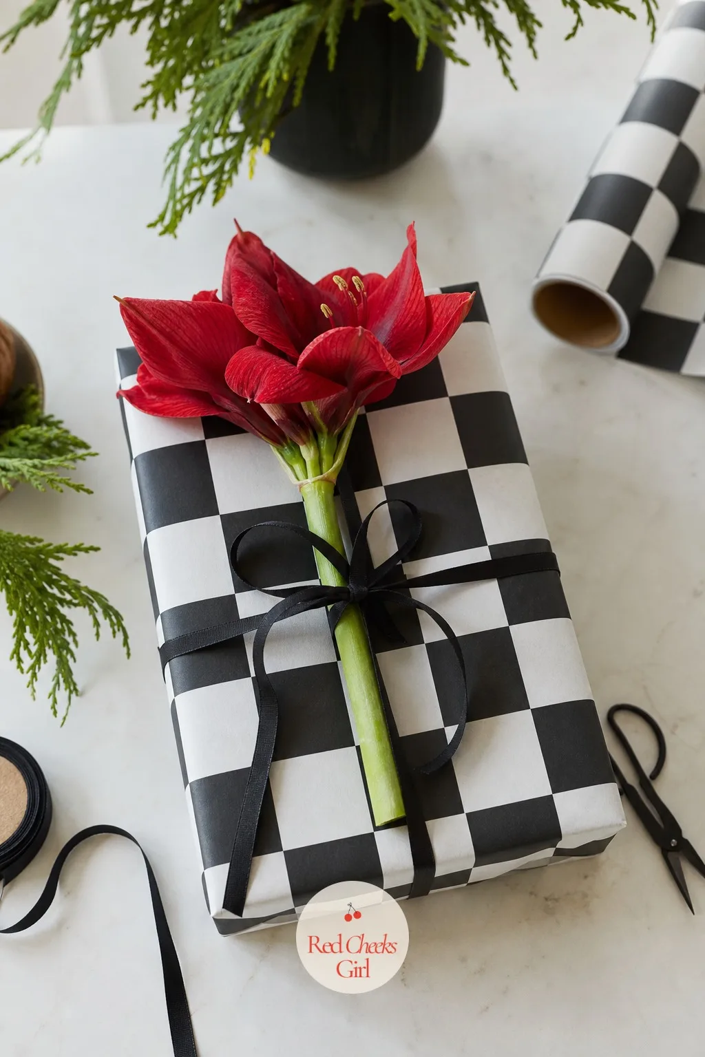 Checkerboard Paper with a Single Amaryllis Stem — Checkerboard is the print that makes a stack of ordinary boxes look like one planned display. Christmas gift