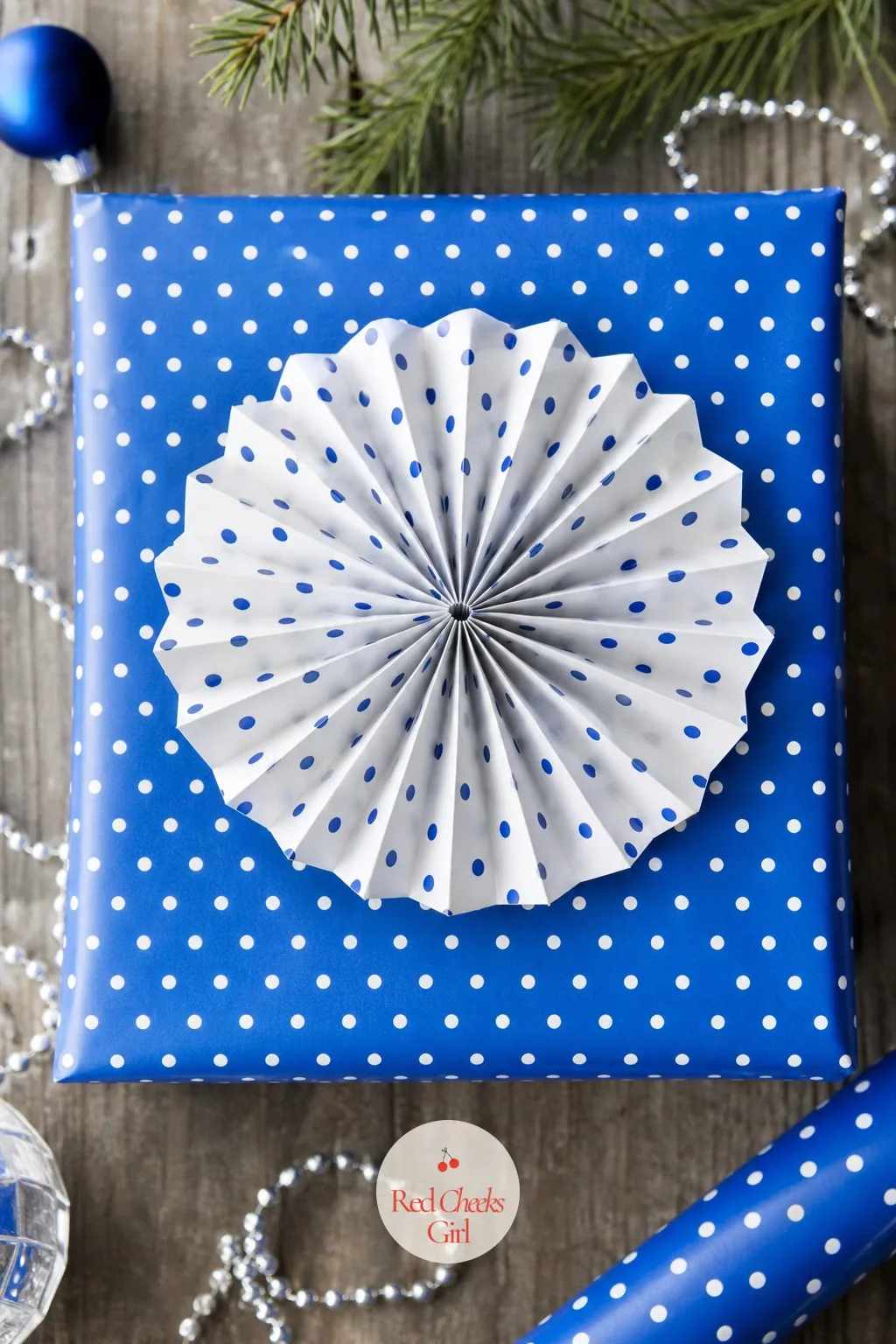 Cobalt Polka Dot Paper with a Paper Rosette Bow — Skip the ribbon aisle completely. Christmas gift wrapping ideas