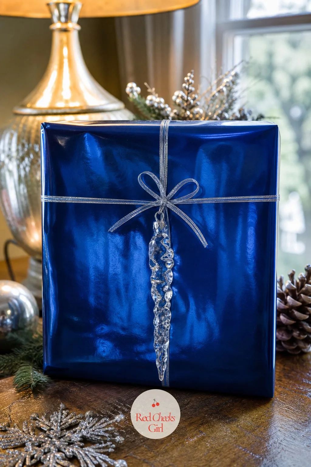 Sapphire Mylar Paper with a Crystal Icicle Ornament — Under lamplight this paper does something flat paper cannot, it throws the light back. Christmas gift