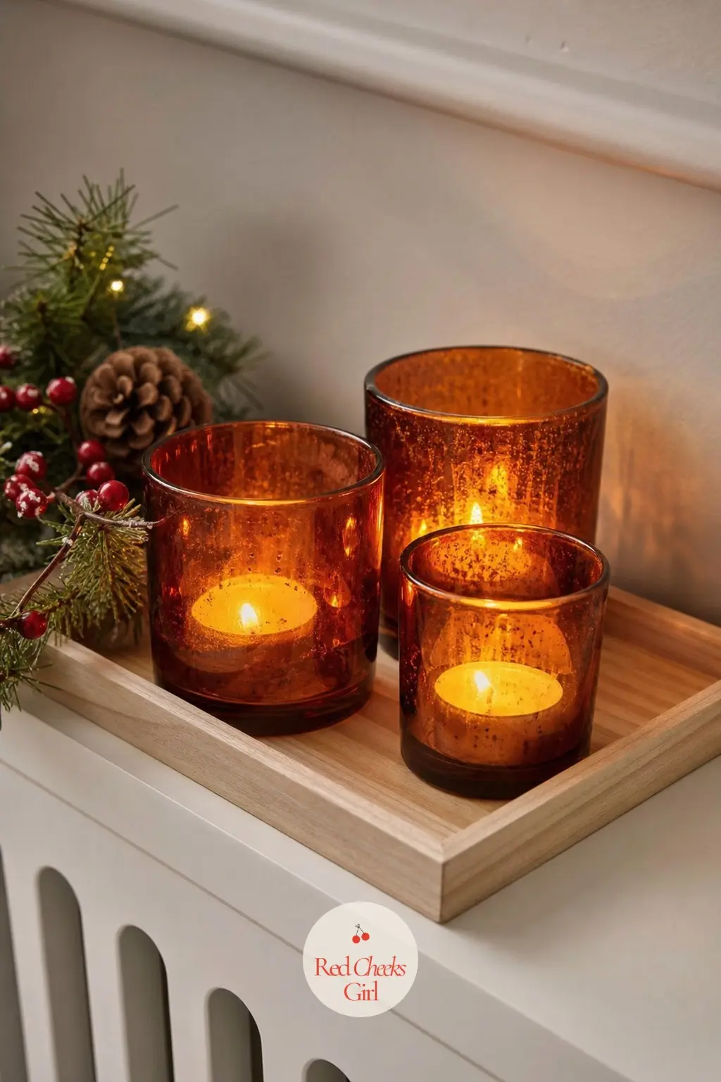 A Wooden Tray of Amber Glass Candles Tucked Onto a Radiator Shelf — Most narrow halls have a radiator cover or windowsill doing nothing useful in December.