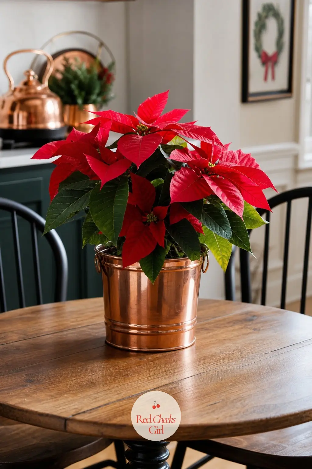 A Round Breakfast Table Set With a Single Poinsettia in a Copper Pail — A small round table does not need much, and one poinsettia set inside a copper pail is