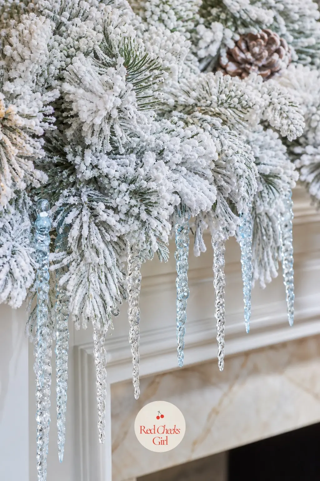 A Flocked White Pine Garland Dripping With Icicle Picks — Flocked garland reads as snow without any actual mess, and it photographs beautifully under warm