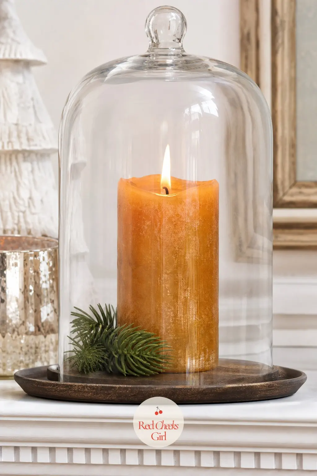 A Glass Cloche Housing a Single Flickering Pillar — A cloche protects an open flame from draughts near a working fireplace, and it turns one candle into a