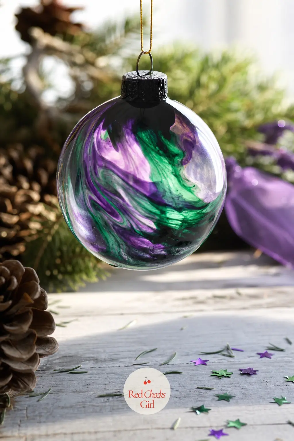 Aurora Swirl Ball — Emerald and violet poured together inside the ball, tilted and rotated against a black-painted top half, mimic the northern lights without