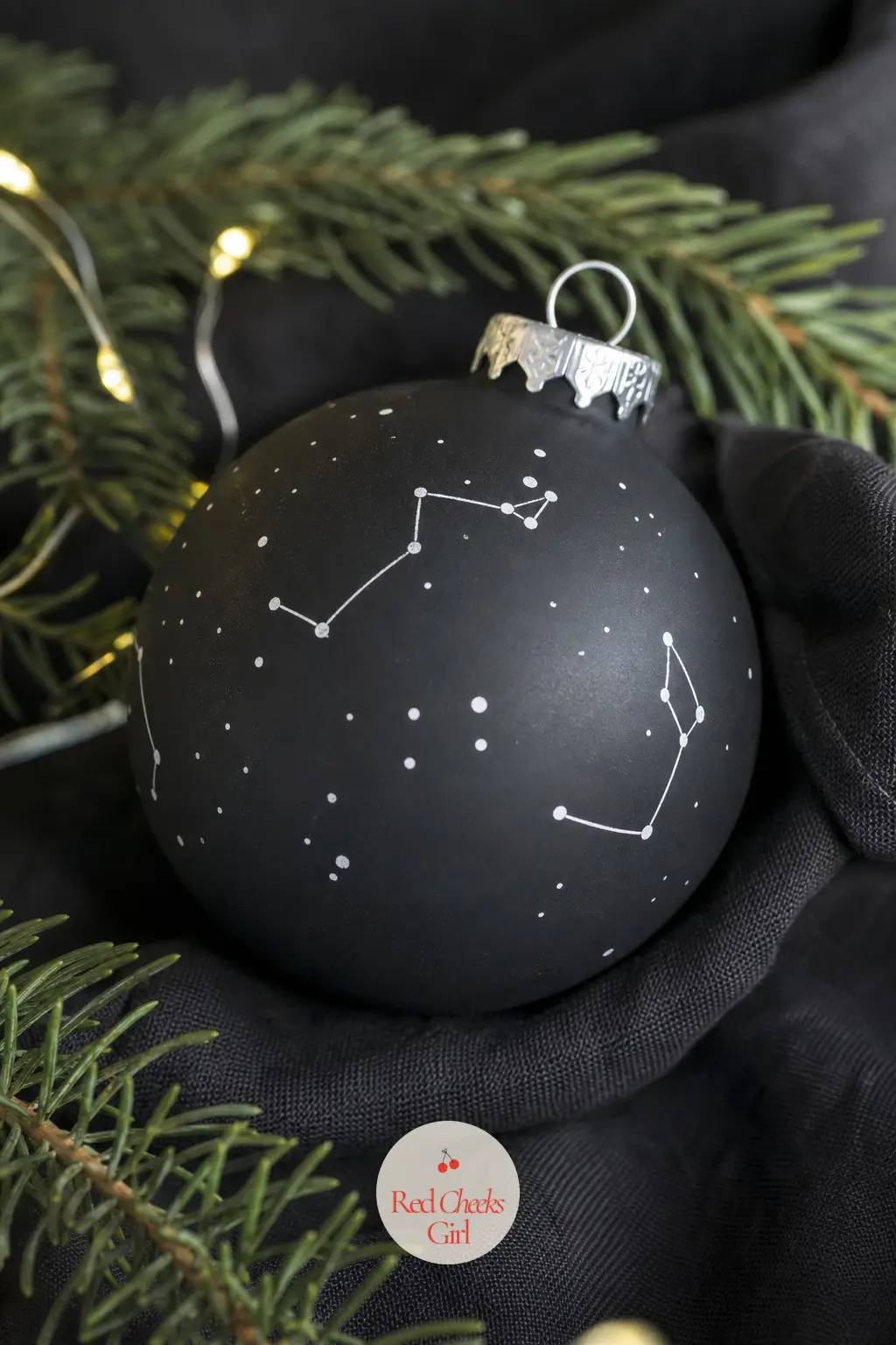 Constellation Dot Map Ball — A matte black base and a white paint pen are the whole supply list. Christmas ornament painting ideas