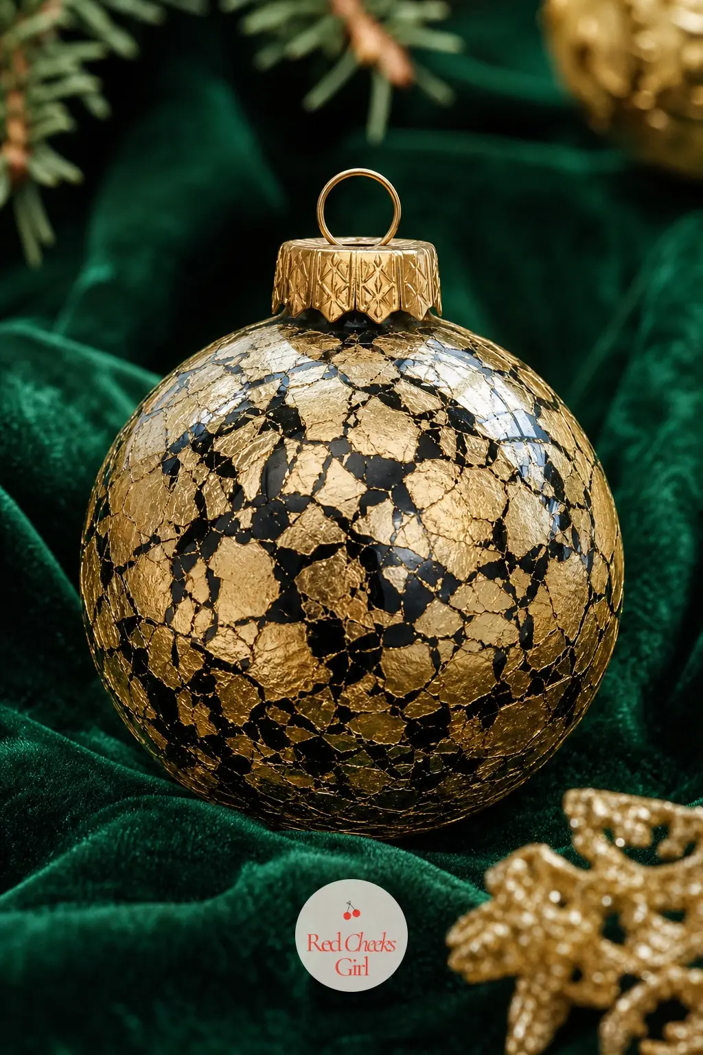 Gold Leaf Fracture Ball — Black paint covers the inside of the ball first, left to dry, then loose fragments of gold leaf press onto the outside over a thin