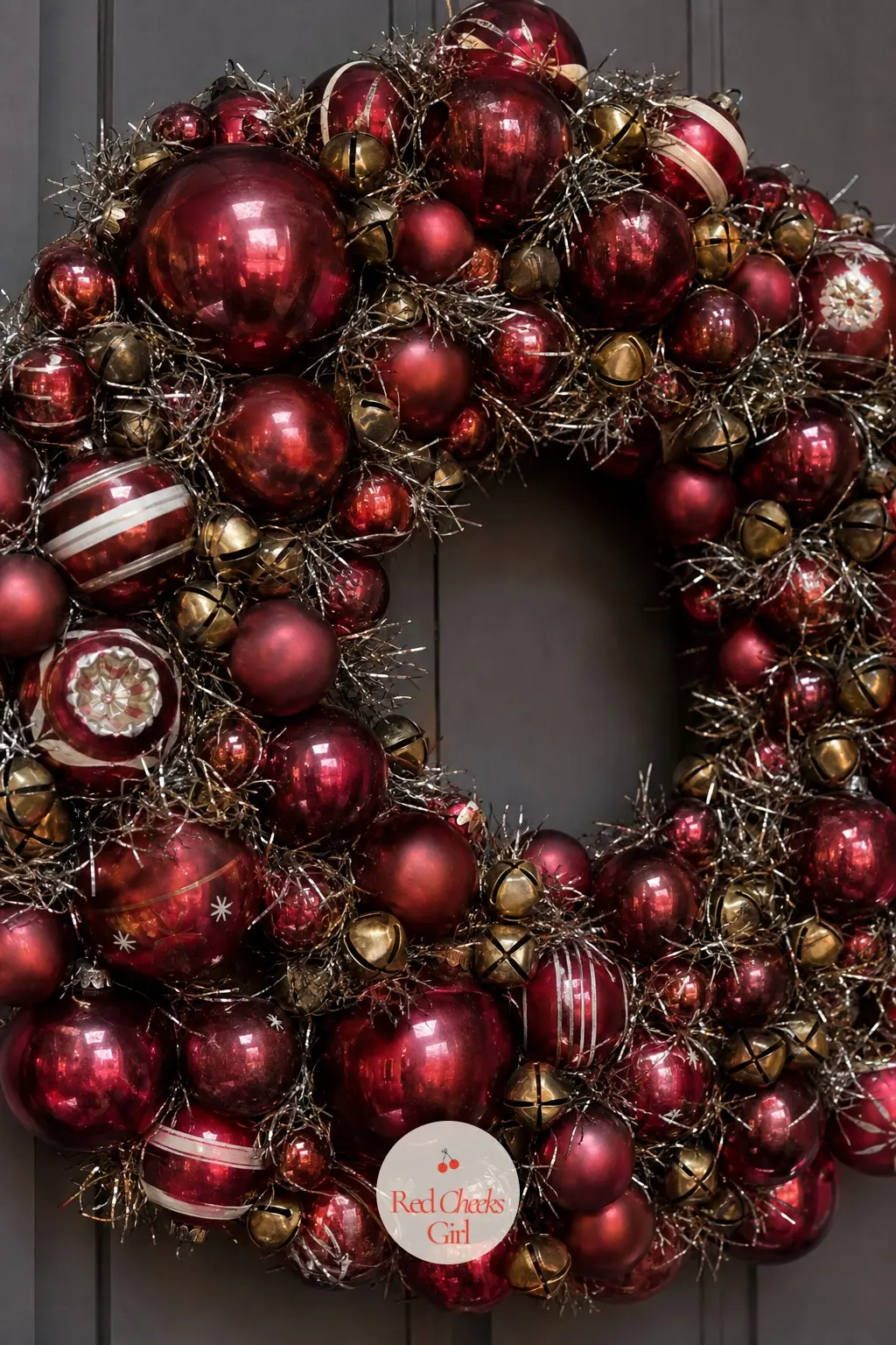 The Cranberry and Brass Vintage Shiny Brite Wreath for the Den — Reproduction Shiny Brite style balls in cranberry red, mixed with a handful of small brass