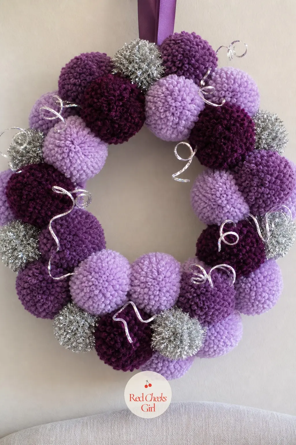 The Grape Purple, Lilac and Silver Pom Pom Wreath for the Reading Corner — Grape and lilac sit close enough on the color wheel to blend softly, and a thread of