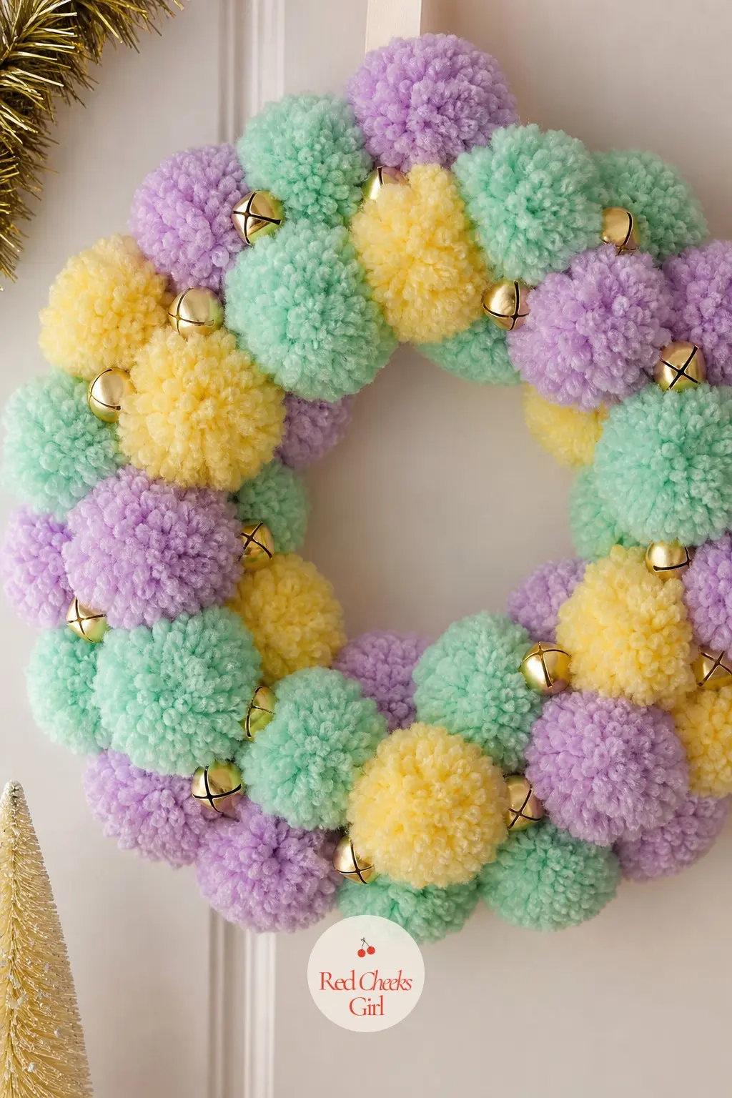 The Mint, Lilac and Buttercup Pastel Pom Pom Wreath for the Playroom — Three pastel candy colors mixed evenly through one wreath reads as a jar of button candy
