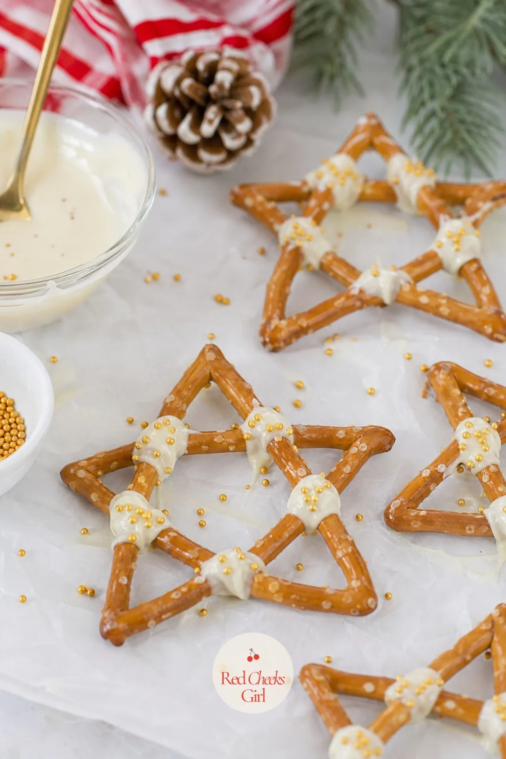 Pretzel Stars Dipped in Chocolate — Arrange five short pretzel sticks in a star shape on wax paper, spoon melted white chocolate over the centre to bind them
