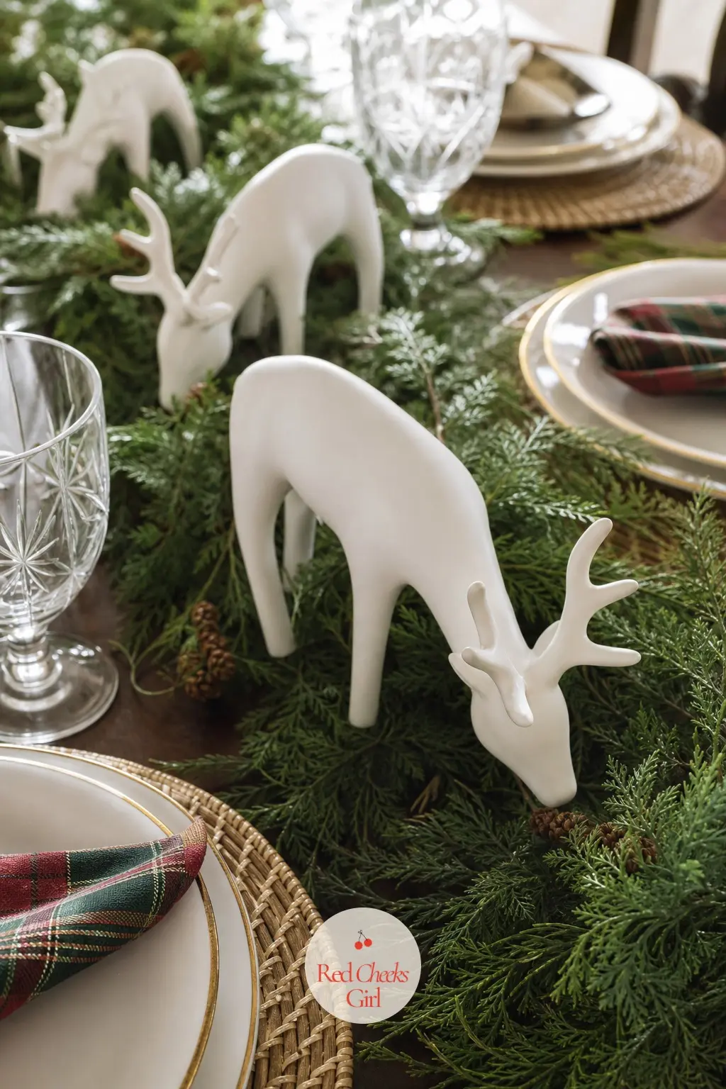 A Ceramic Reindeer Herd Grazing Down the Table's Center — A line of small white ceramic reindeer walking down the middle of the table gives children and adults