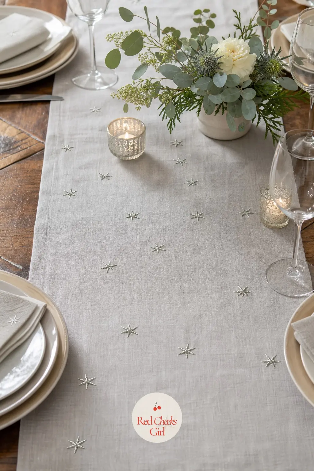 A Dove-Grey Linen Runner Hand-Stitched With Silver Stars — Dyed a soft dove grey rather than left in its natural state, this runner reads as considered rather