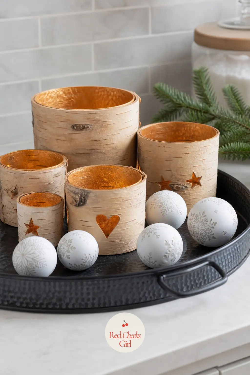 A Galvanized Tray of Birch Bark Votive Cups and Painted Ceramic Snowballs — A handful of birch bark votive cups sit scattered among painted white ceramic