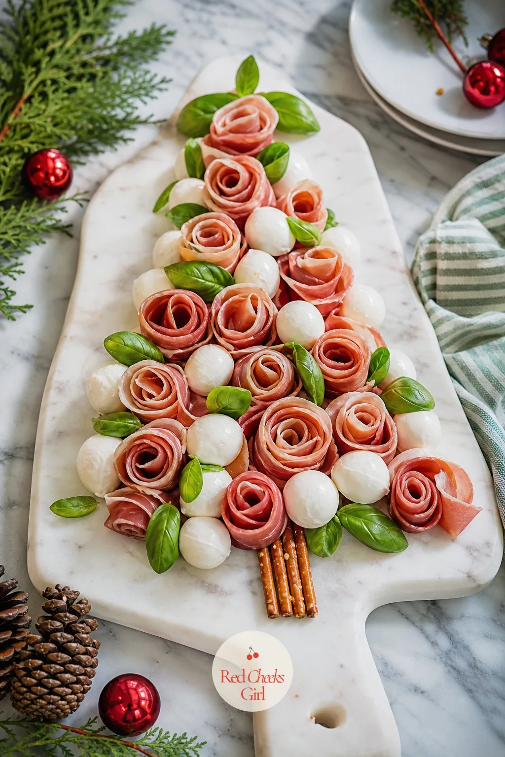 Prosciutto Rose Tree — This is the one that looks like it cost more effort than it did. Christmas tree charcuterie board