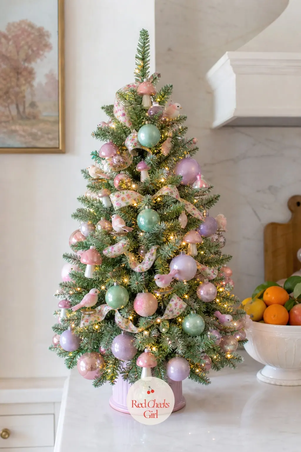 The Tabletop Tree in Sherbet Pastels — This mini artificial tree sits on a counter rather than a floor, dressed in lavender and mint balls, mini glass