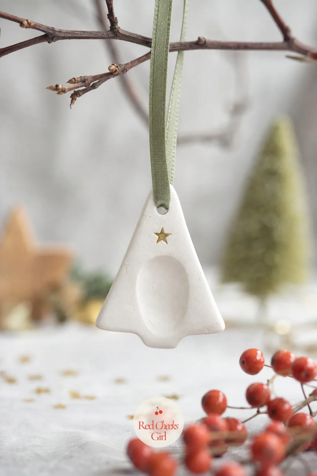 Clay Thumbprint Star-Topped Tree Charm — White air dry clay rolled flat, cut into a simple triangle with a butter knife, then a thumb pressed firmly into the