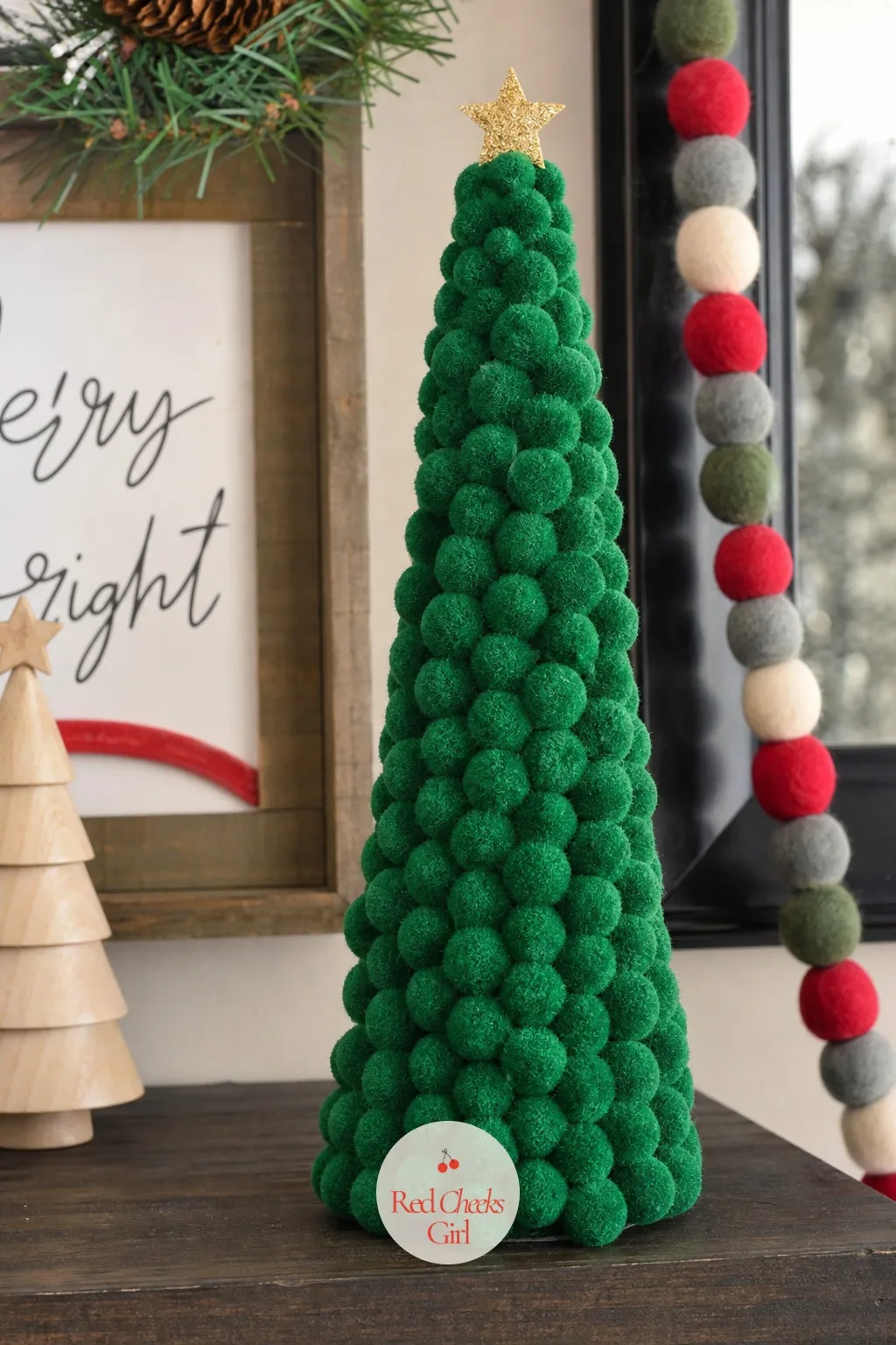 Pom-Pom Pine Tree Cone — A plain foam or cardboard cone covered edge to edge in hunter green pom poms looks disproportionately good for how little skill it