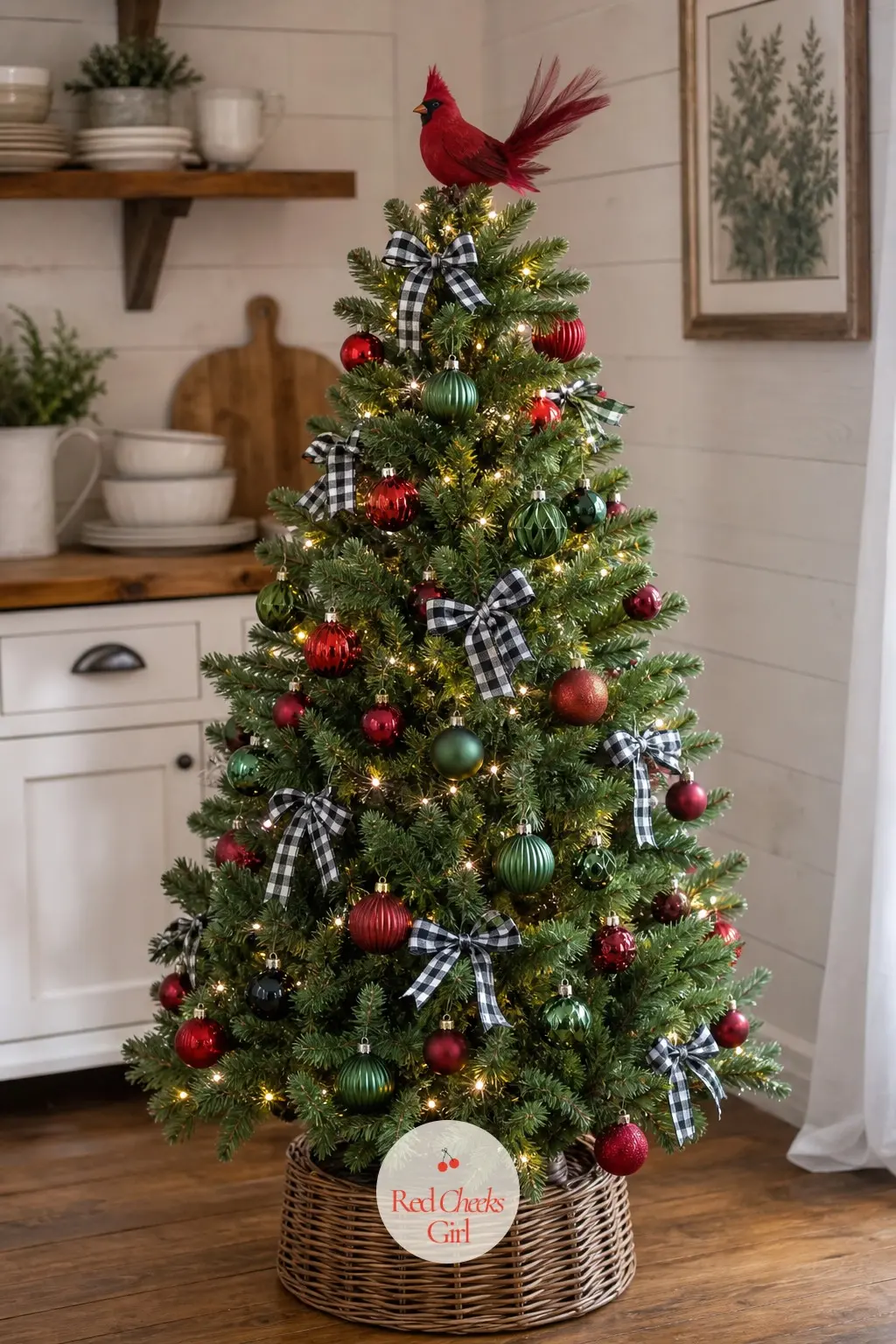 The Cardinal and Tartan Tree — Compact and rounded rather than tall, this artificial tree keeps its cardinal topper at a height where its red feathers and the