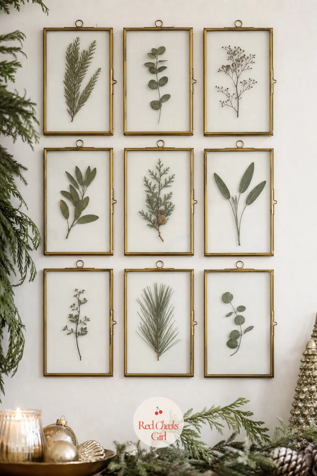A Grid of Pressed Winter Botanicals Framed in Slim Brass — Pressed stems in sage and dusty green look more like a botanical study than a holiday decoration