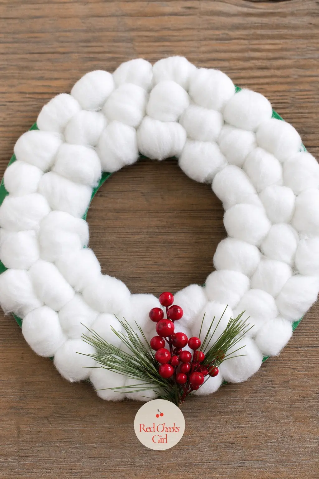 Cotton Ball Snow Wreath — Stretch cotton balls thin and glue them densely around a green-painted ring until the texture looks like packed snow. Christmas