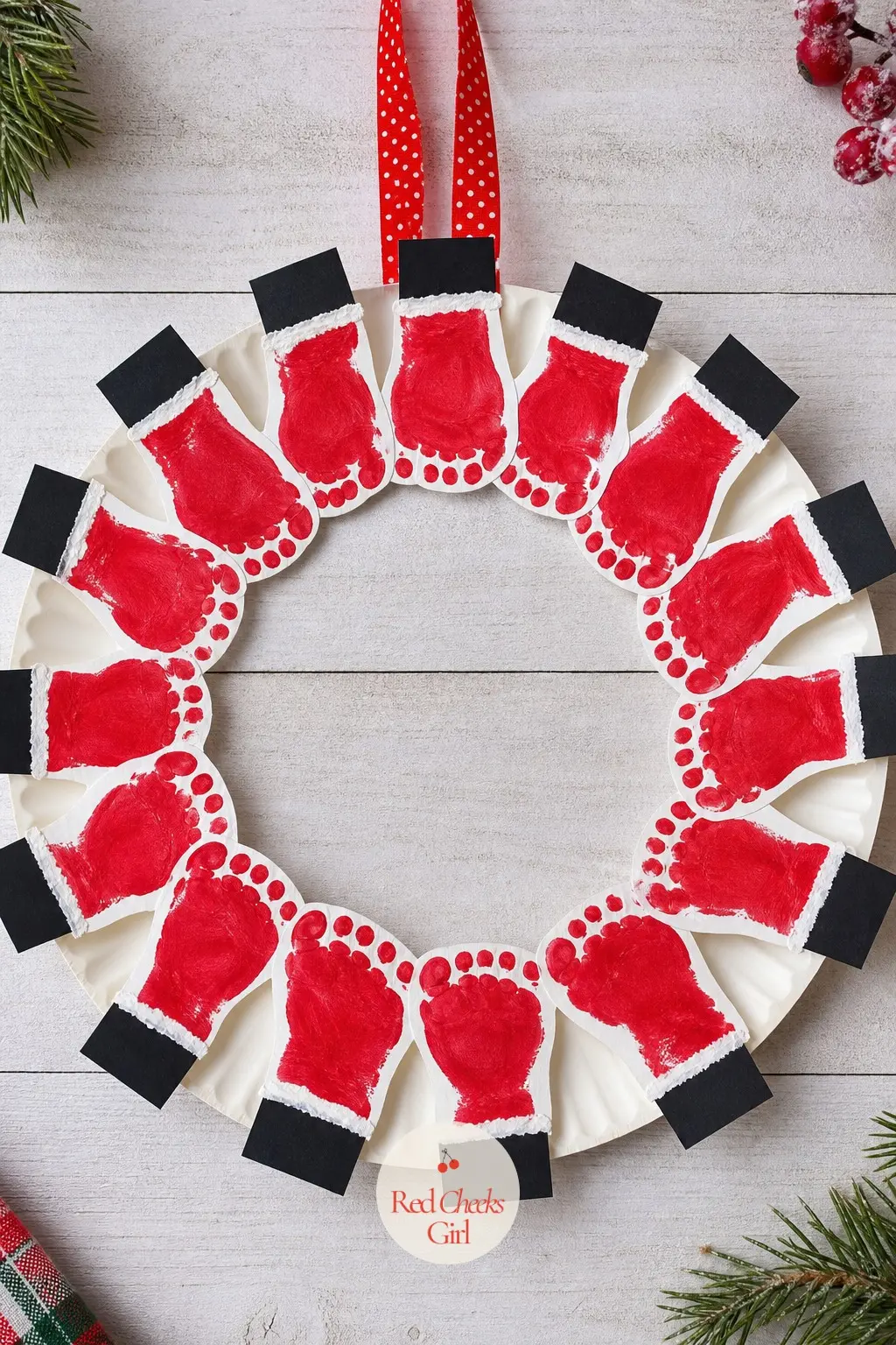 Footprint Santa Boot Wreath — For a baby or toddler too small for a tidy handprint, red and white paint footprints along the outer edge of a paper plate ring