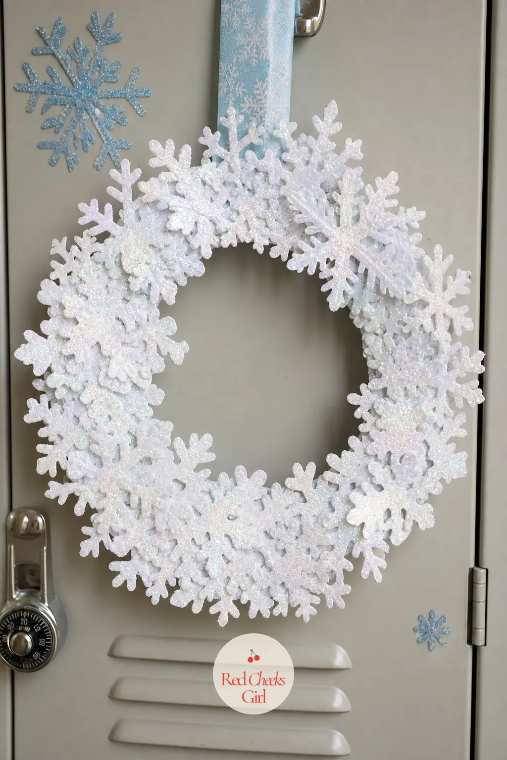 Glitter Snowflake Paper Wreath — Cut a dozen snowflakes from white cardstock, brush each one with glue, and coat them in iridescent glitter before they overlap