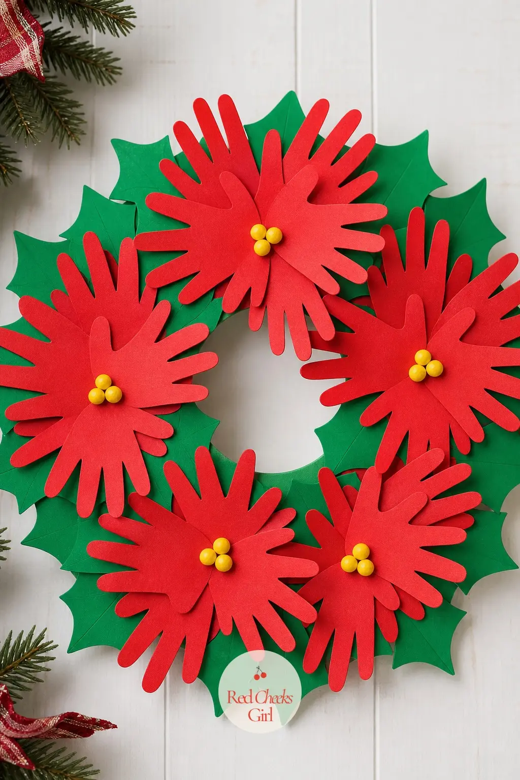 Handprint Poinsettia Wreath — Layer red paper handprints in twos and threes around a ring so they read as poinsettia petals, then glue a small yellow paper