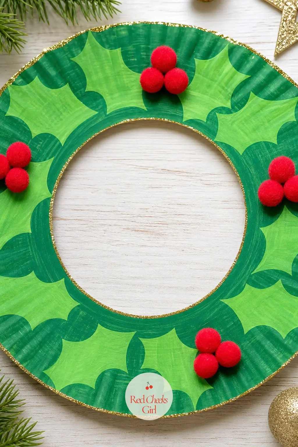 Holly Leaf Paper Plate Wreath — Paint the ring in two shades of green, let it dry, then dab on clusters of red pom pom berries in threes along the rim.
