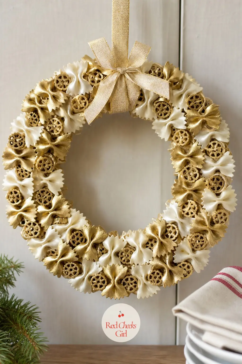 Pasta Noodle Wreath — Spray-paint a mix of bow-tie and wagon-wheel pasta in gold and ivory, let it dry completely outside or in a well-aired garage, then glue