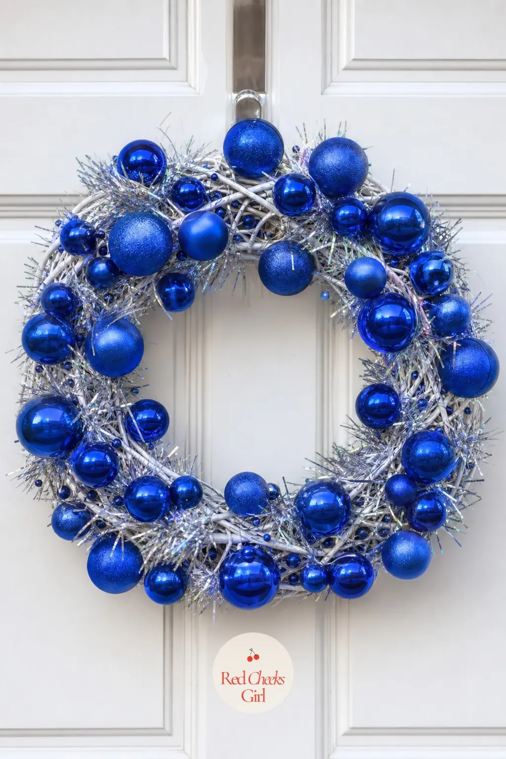 Cobalt Blue Ornament Wreath — A pale twig base loaded with glossy cobalt blue ornaments and a thread of silver tinsel. Christmas wreaths for front door
