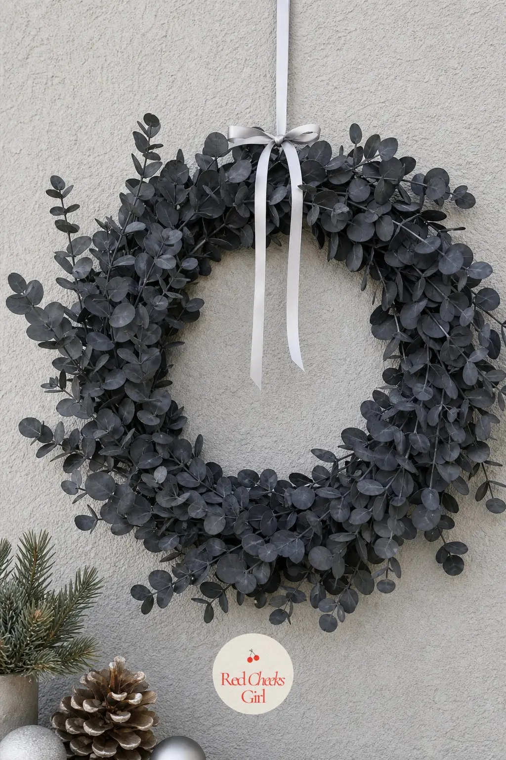 Monochrome Charcoal Eucalyptus Wreath — Eucalyptus leaves painted a uniform charcoal grey, finished with a thin white ribbon and nothing else. Christmas