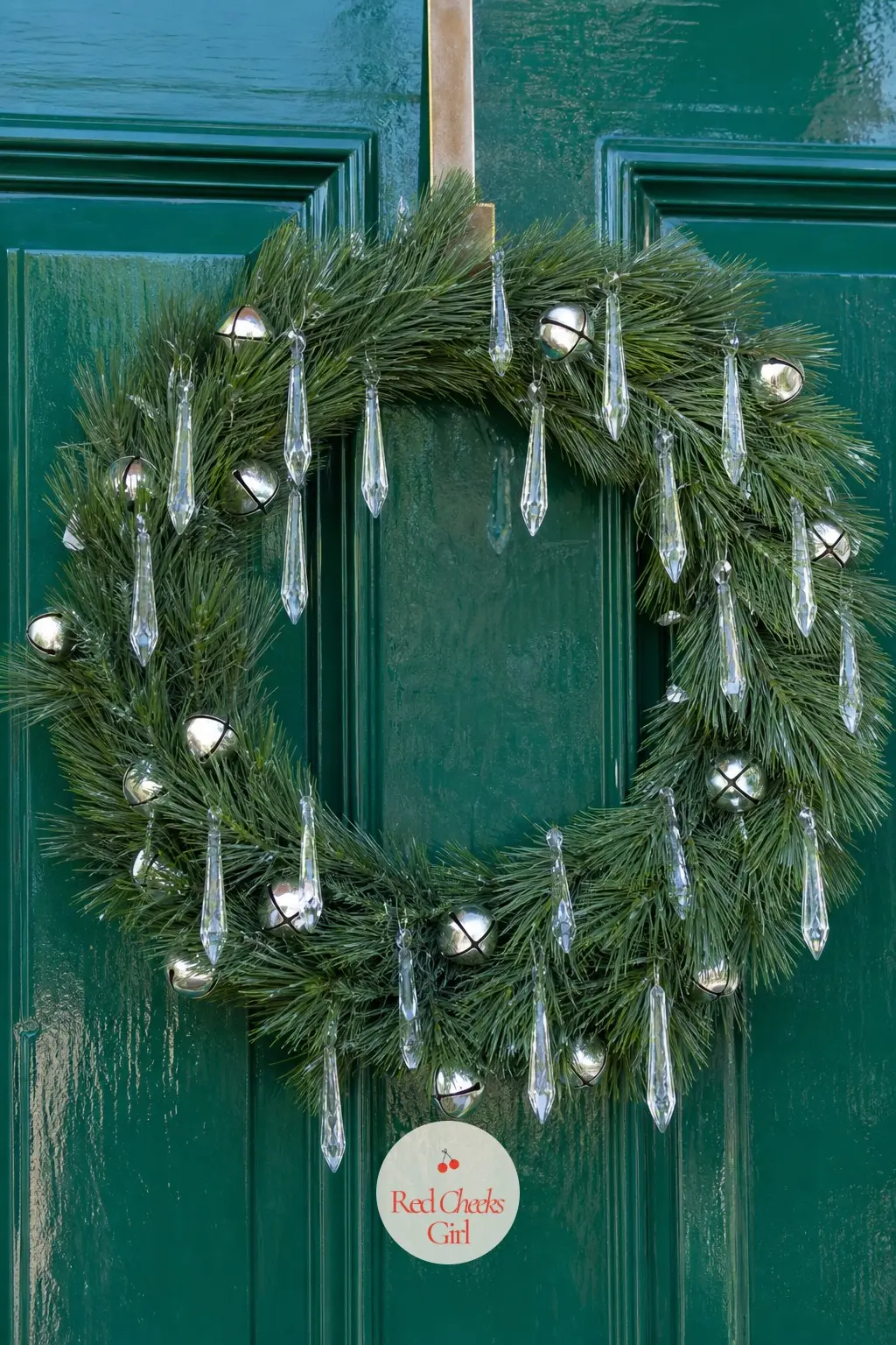 Silver Bells and Crystal Icicle Wreath — A plain white pine ring strung with small silver bells and clear acrylic icicles that catch and throw light. Christmas