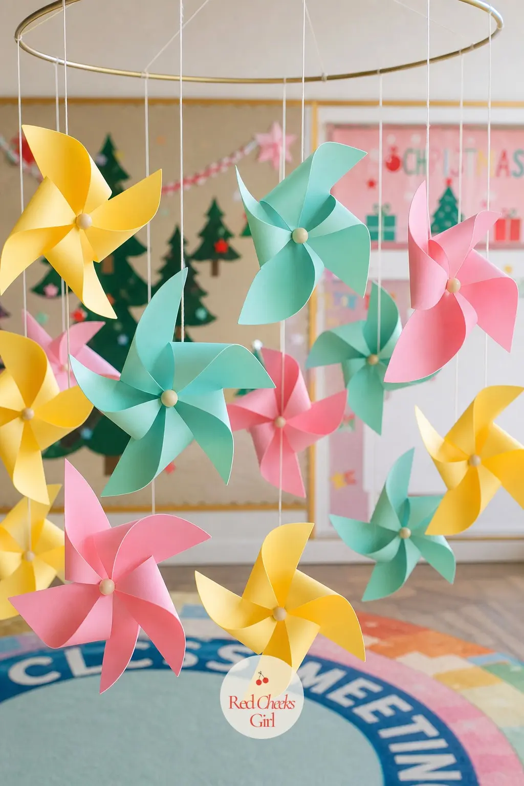 A Spinning Pinwheel Ornament Mobile Over the Class Meeting Rug — Cut pastel cardstock into pinwheel shapes, pin each with a single brass fastener so the blades