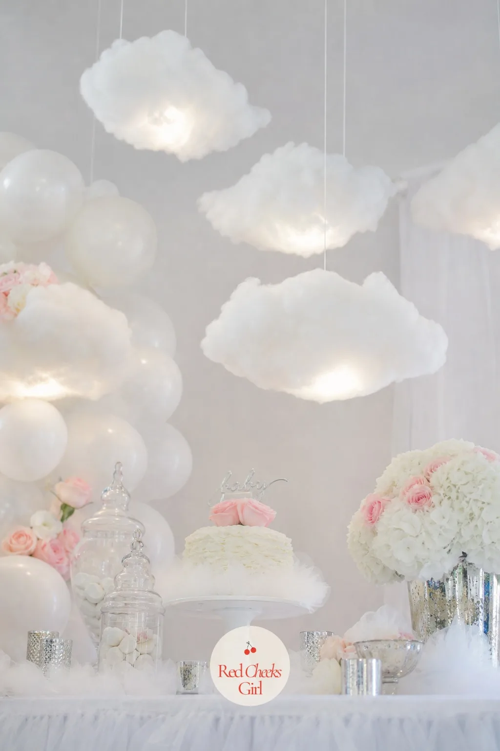 Clouds Hung From the Ceiling — A flat ceiling makes a room feel low. Cloud 9 baby shower theme