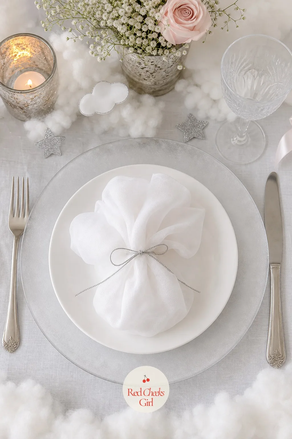 Frosted Glass Chargers with Cloud Napkin Fold — A bare plate at each seat reads unfinished before anyone sits down. Cloud 9 baby shower theme
