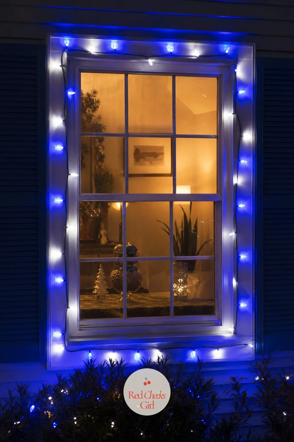 Cobalt Blue and White Lights Framing Every Windowpane — From the street, a window with its own little frame of light reads as deliberate in a way a strand