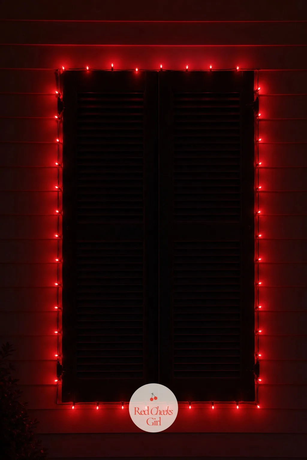 Ruby Red Mini Lights Outlining the Shutters — One confident colour on a shutter does more than three fighting for the same six inches of wood. Colored