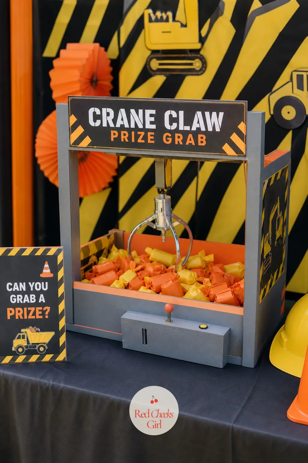 Crane Claw Prize Grab Station — Every job site has a piece of equipment that looks too fun to be work, and this station borrows exactly that feeling.