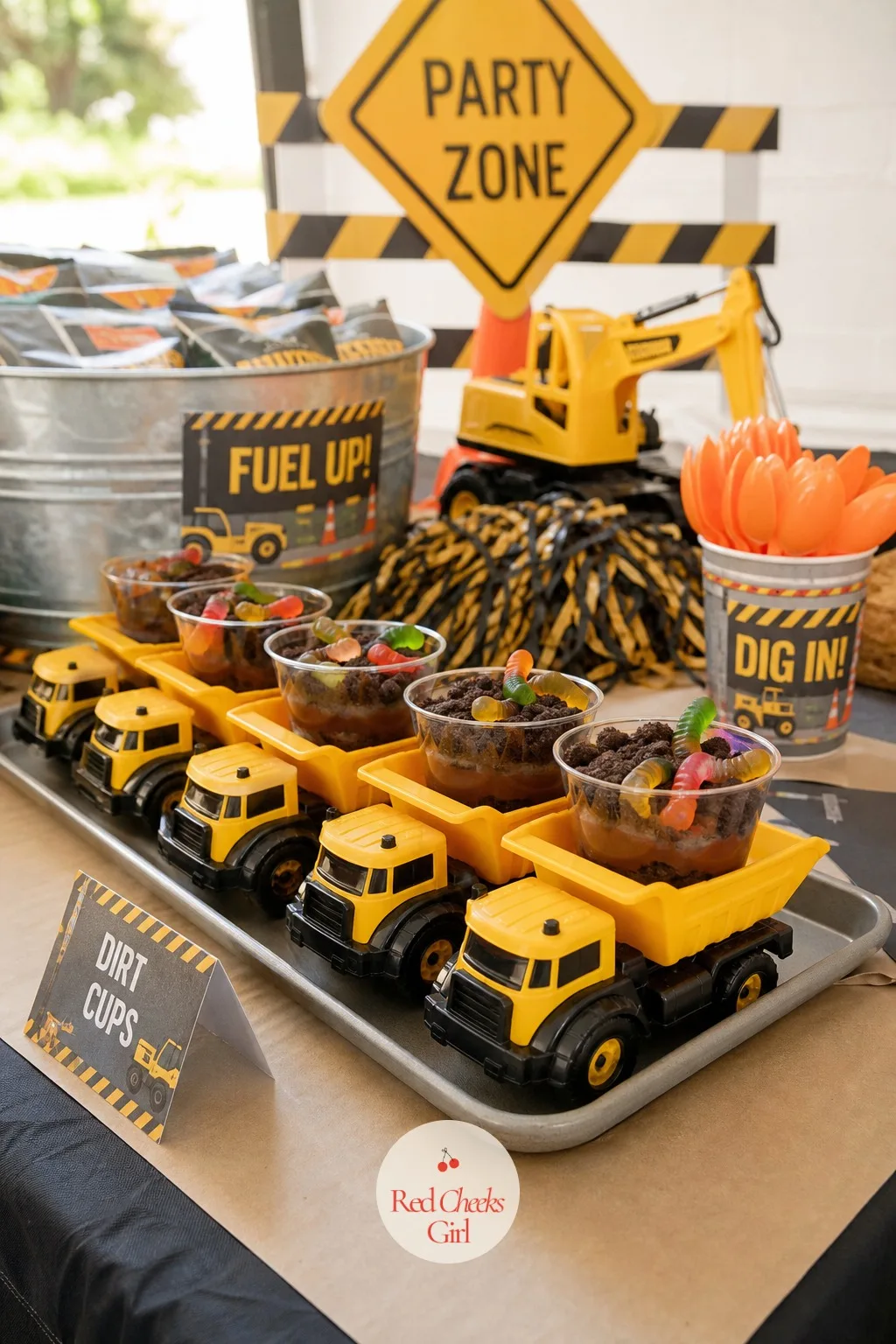 Dirt Cup Snack Table With Dump Truck Bowls — Nothing on this table needs a trip to a specialty bakery, which is the whole relief of it. Construction birthday