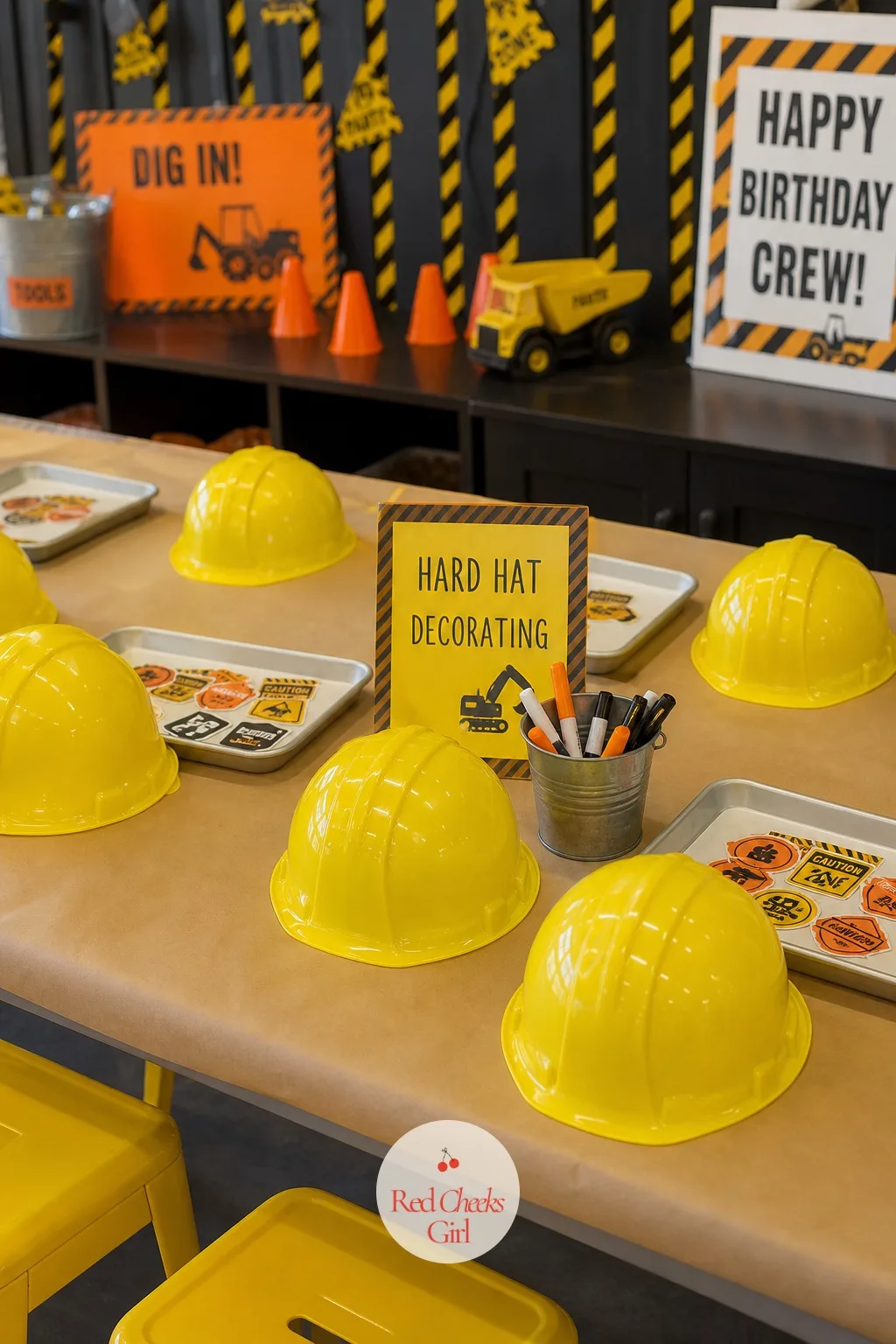 Hard Hat Decorating Table — Some guests arrive too shy for a running game but perfectly happy at a table with stickers. Construction birthday party
