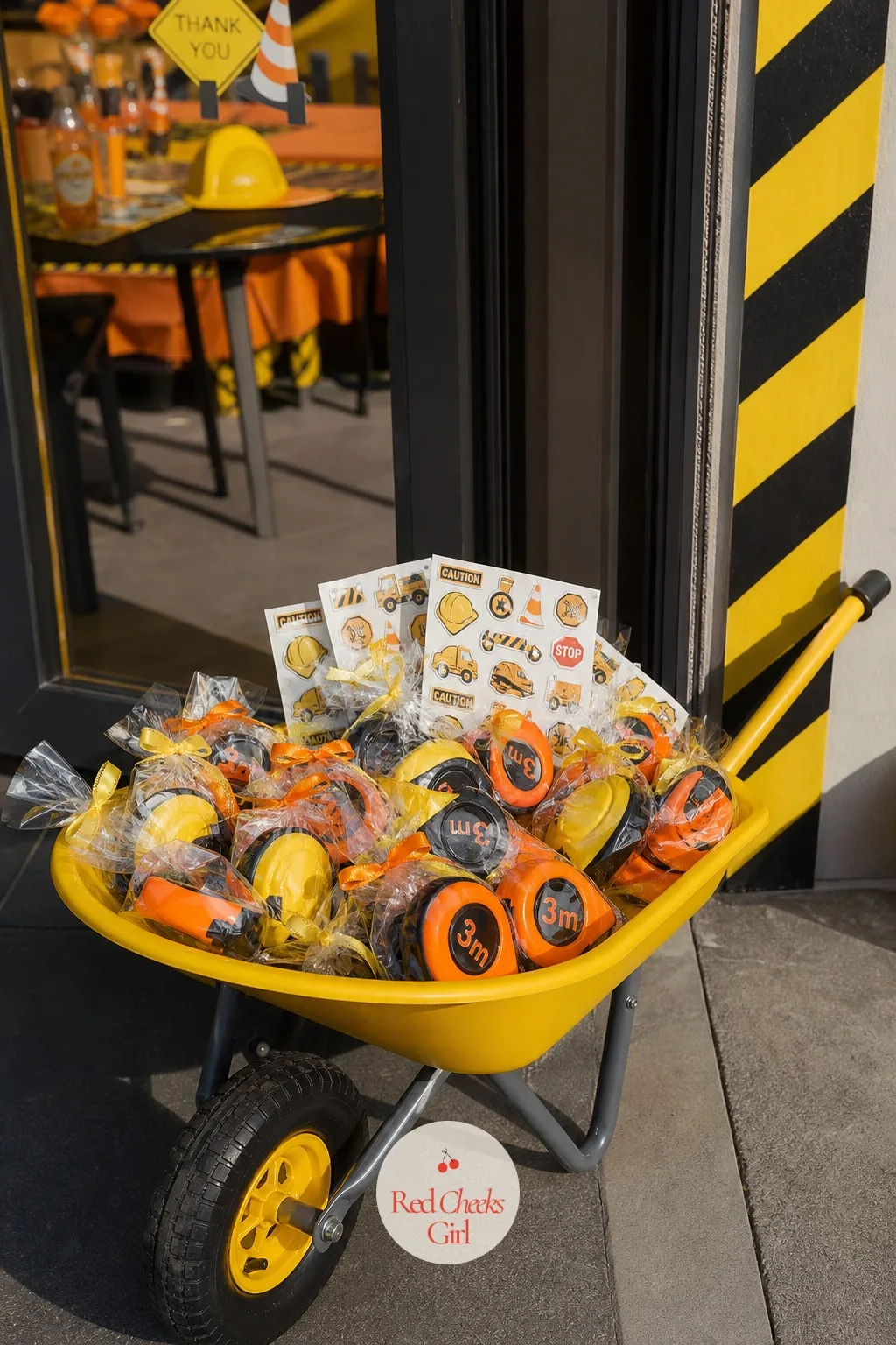 Wheelbarrow Of Party Favors With Tape Measures — A favour table that just sits there feels flat, but a wheelbarrow parked by the door asks to be dug through.