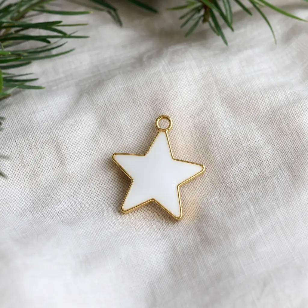 Enamel Star Ornament — A small enamel ornament, a star or a simple shape, meant for a tree she already has at home rather than another desk object. Coworker